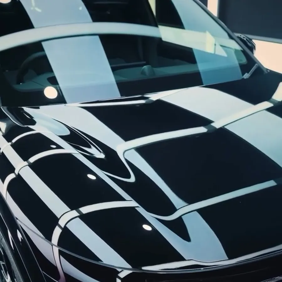 Mirror gloss on a black SUV bonnet
