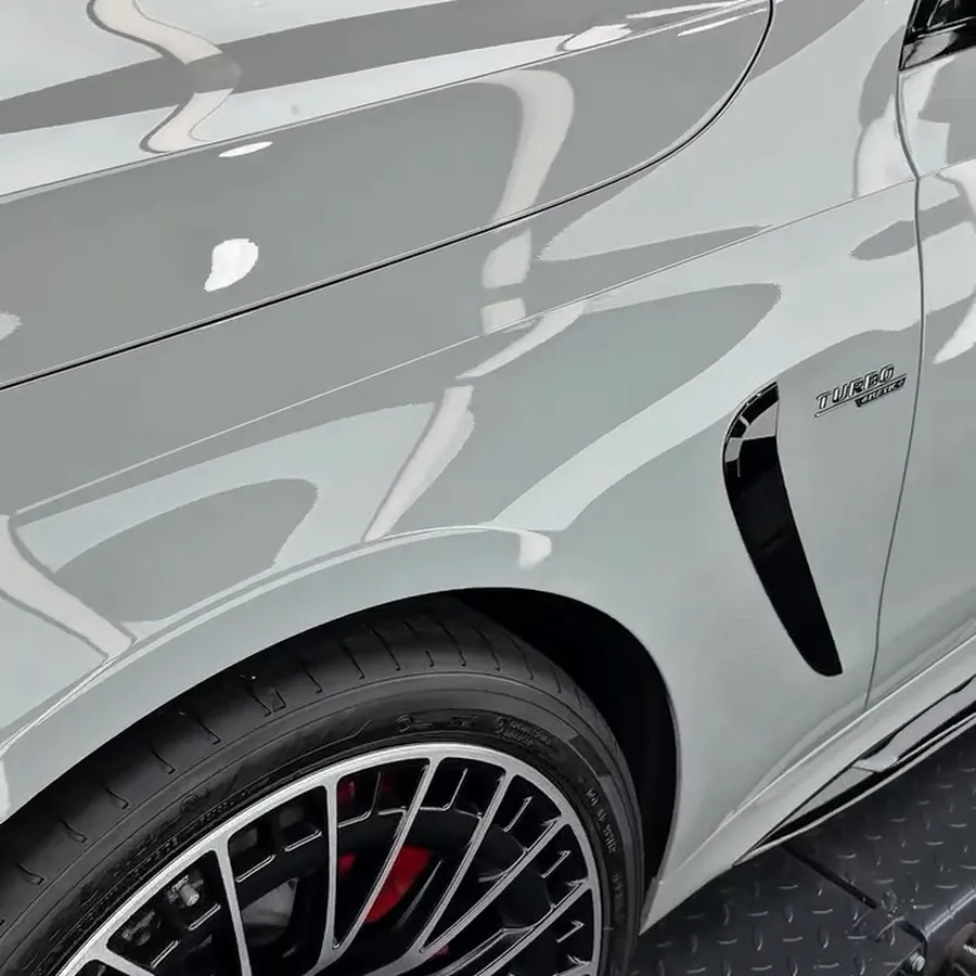 Gloss white paint over a clean multi-spoke wheel